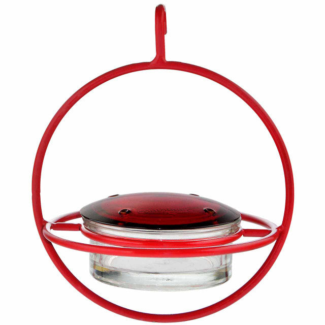 Red hummingbird feeder on a white background