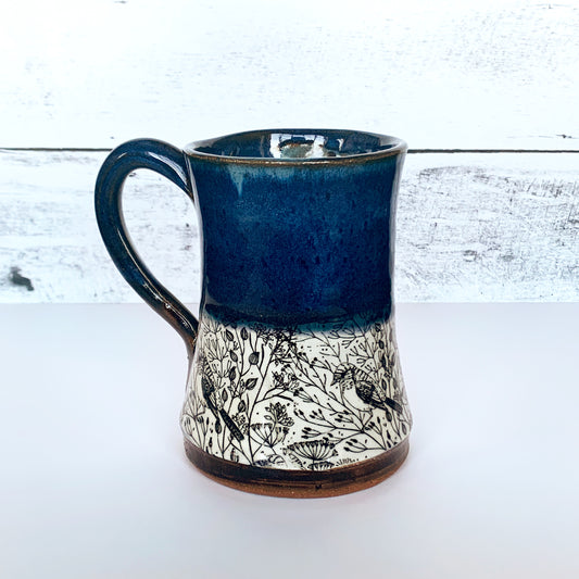 Handmade Pottery Mug featuring birds and flowers